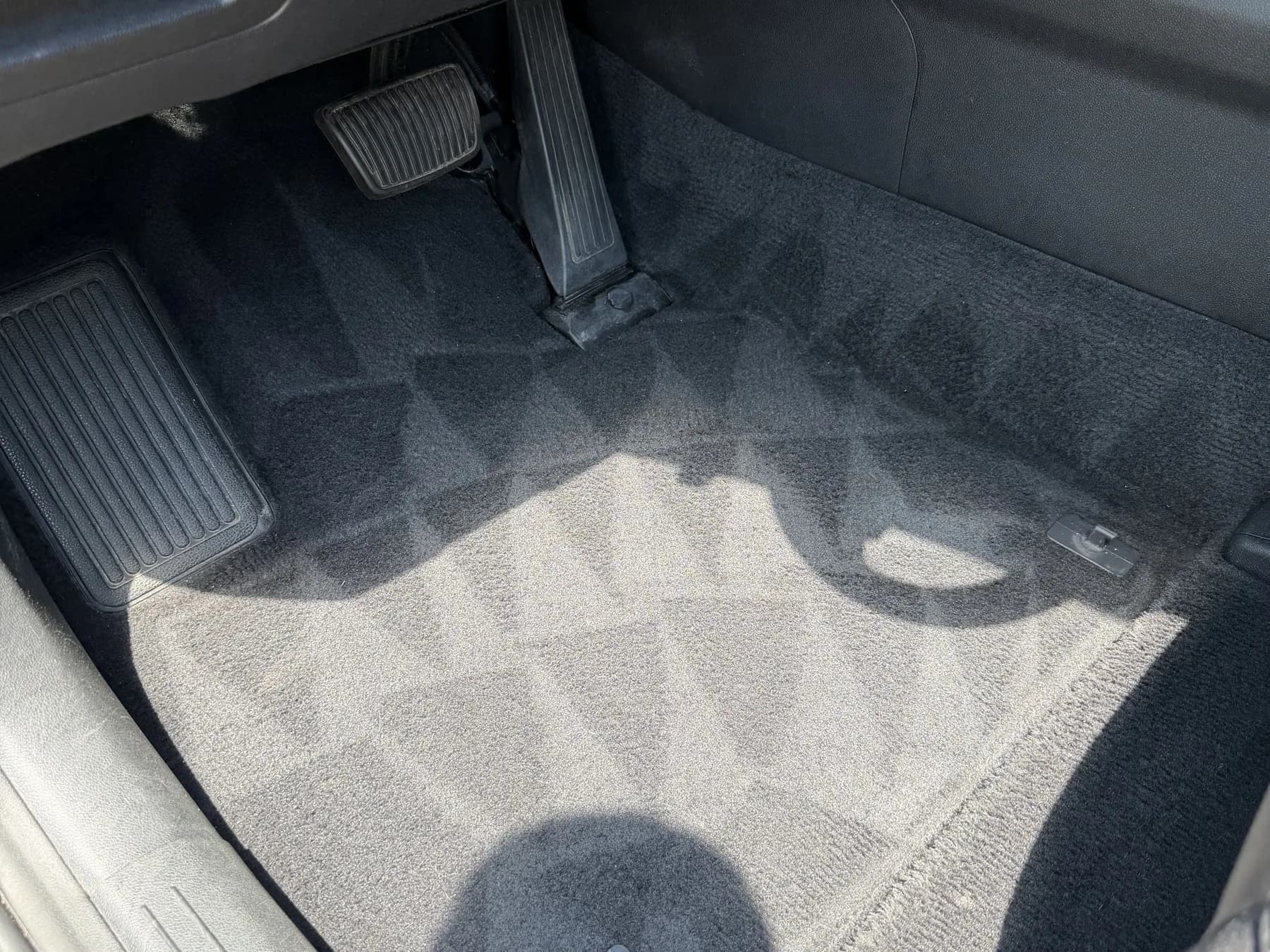 Driver footwell carpet shampooed and extracted clean after an interior detail at Waterford Auto Shine